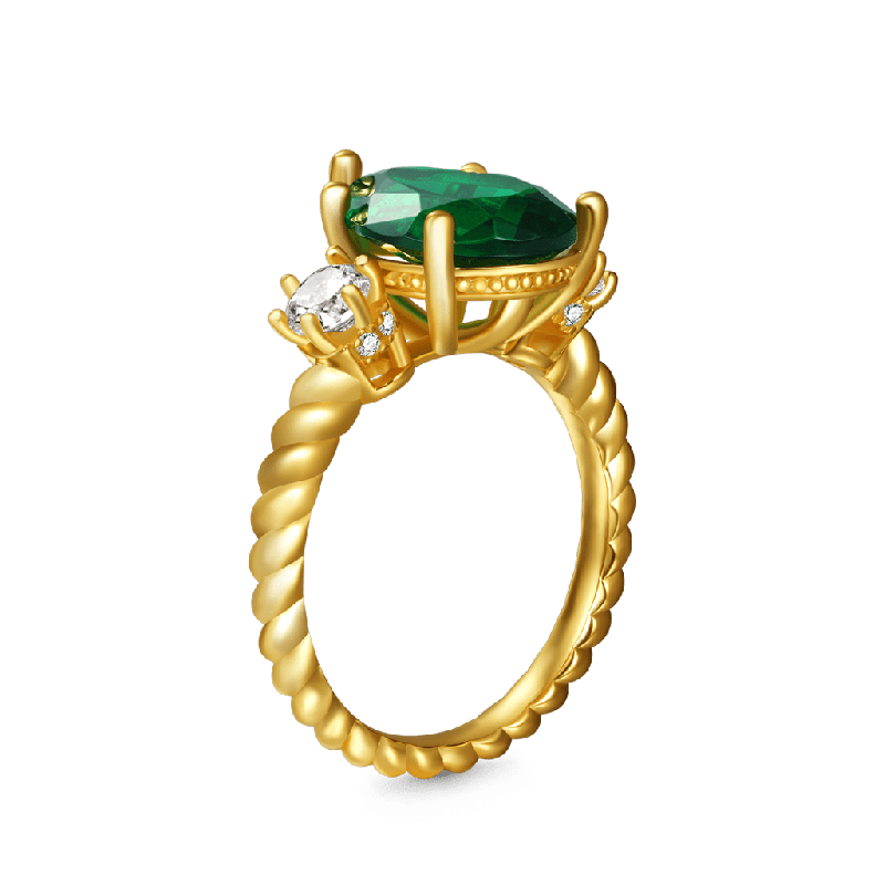 Pear-cut Emerald Three-stone Ring