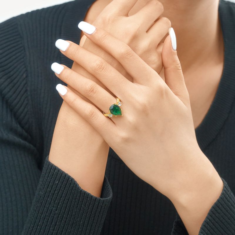 Pear-cut Emerald Three-stone Ring
