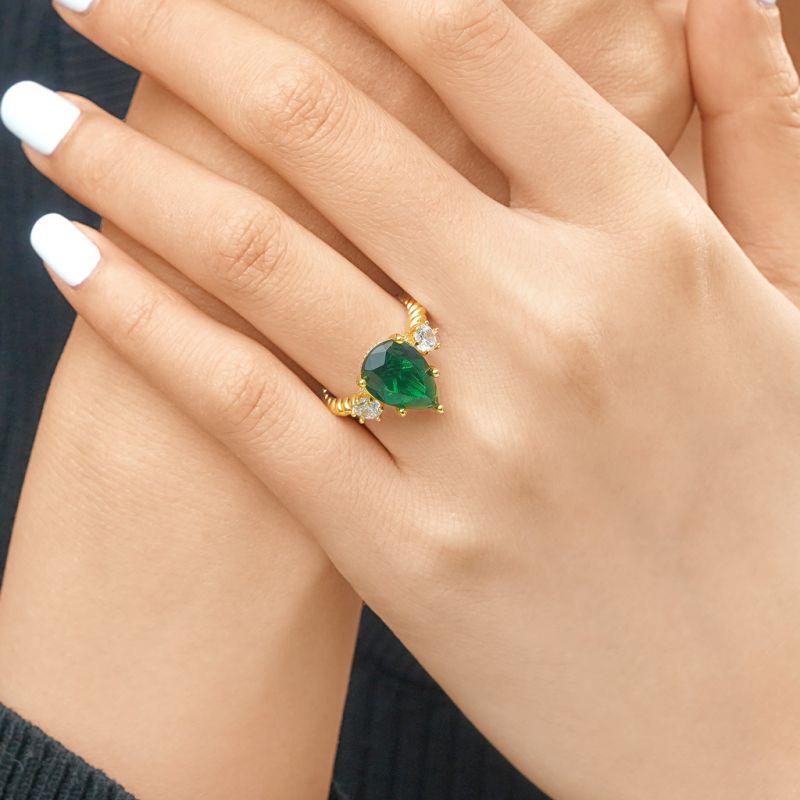 Pear-cut Emerald Three-stone Ring