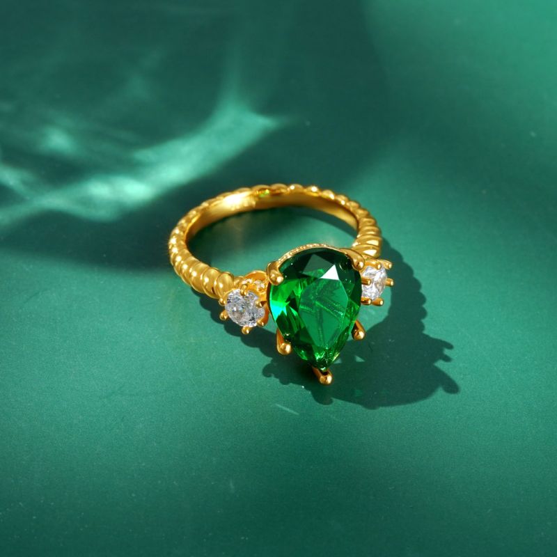 Pear-cut Emerald Three-stone Ring